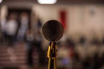 To express the importance of open mics while pursuing stand-up comedy.